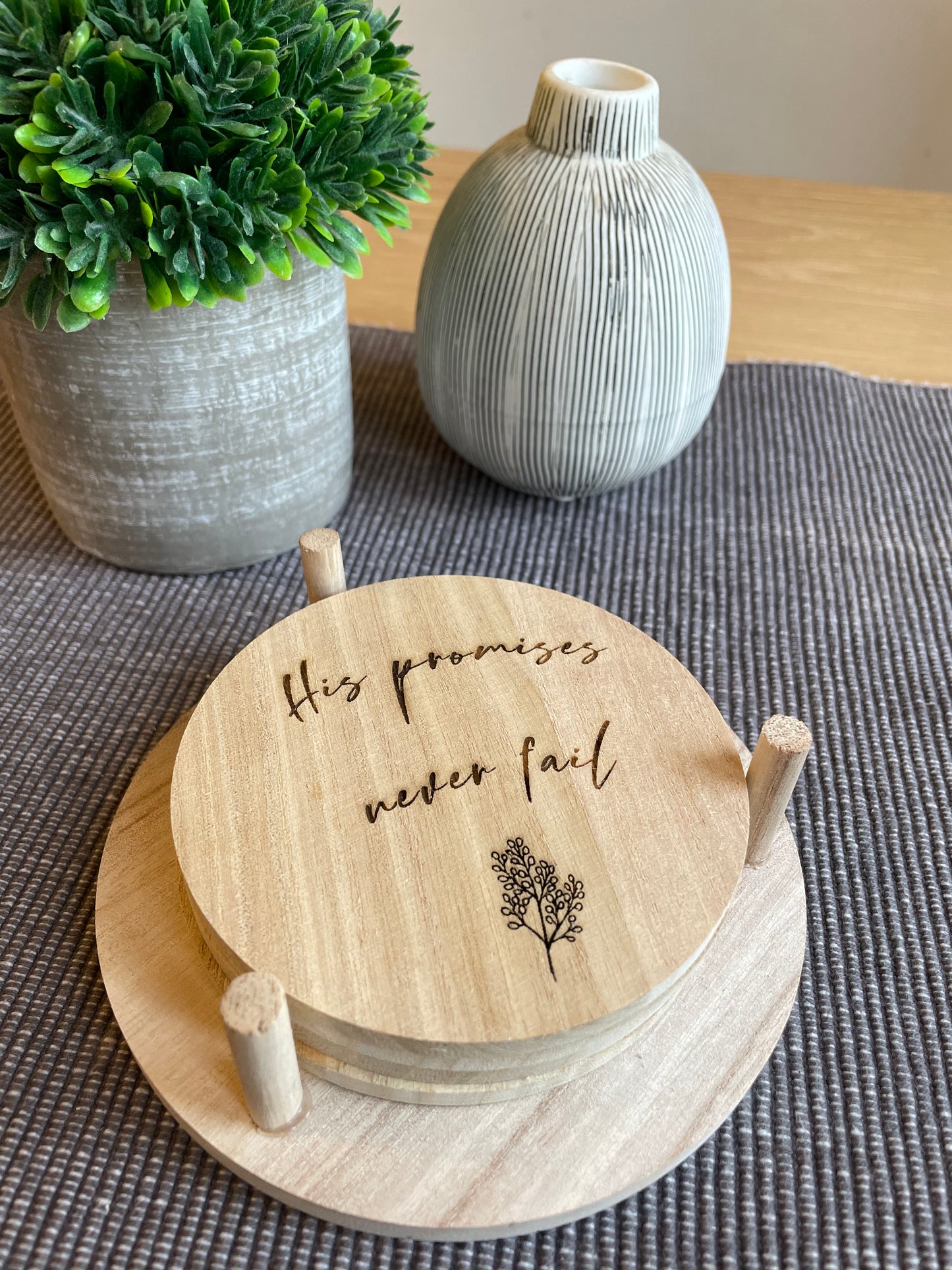 four coaster set in holder, front view, beige engraved