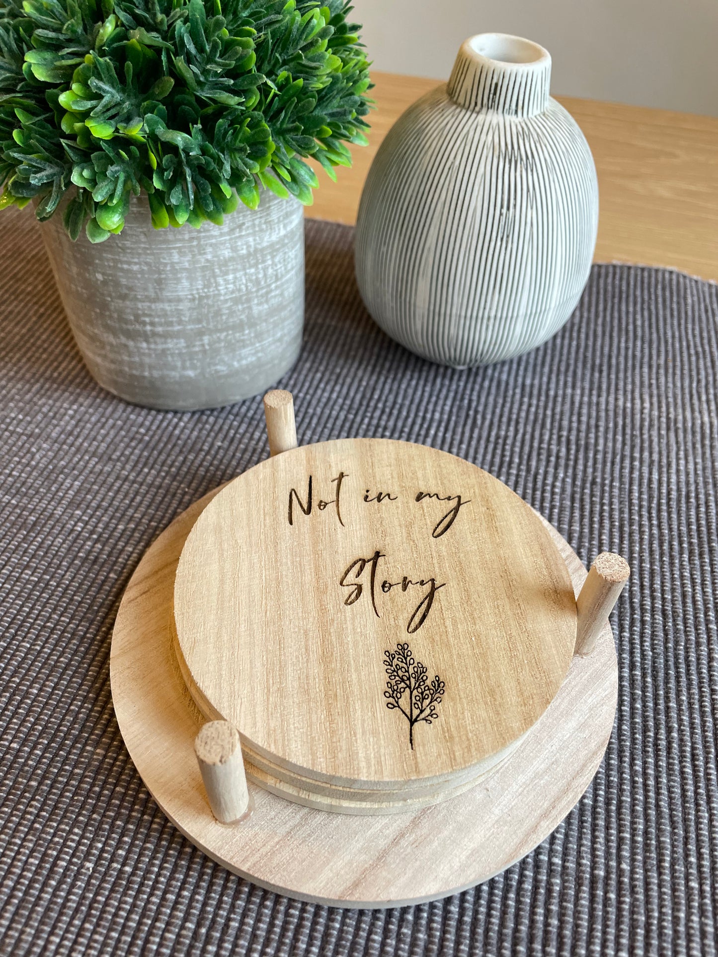 not in my story, coaster, Birds Eye front view, beige engraved